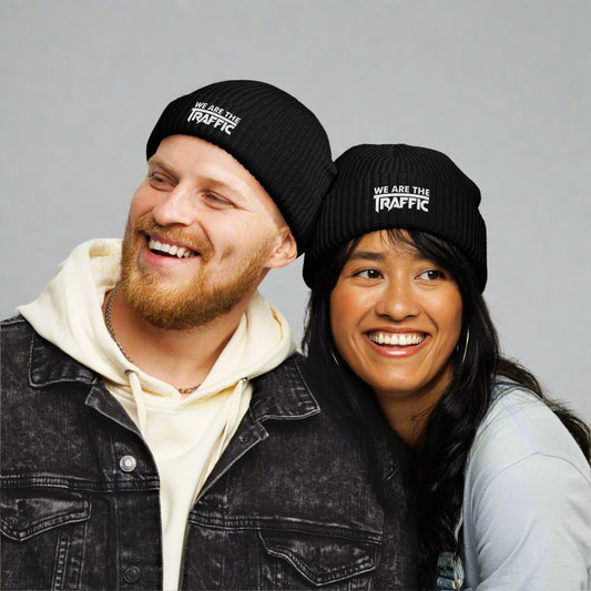 man and woman wearing black logo beanie