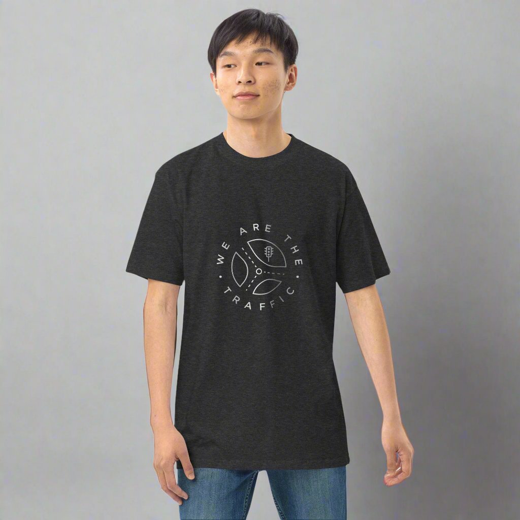 male model wearing charcoal gray t-shirt with circular logo design