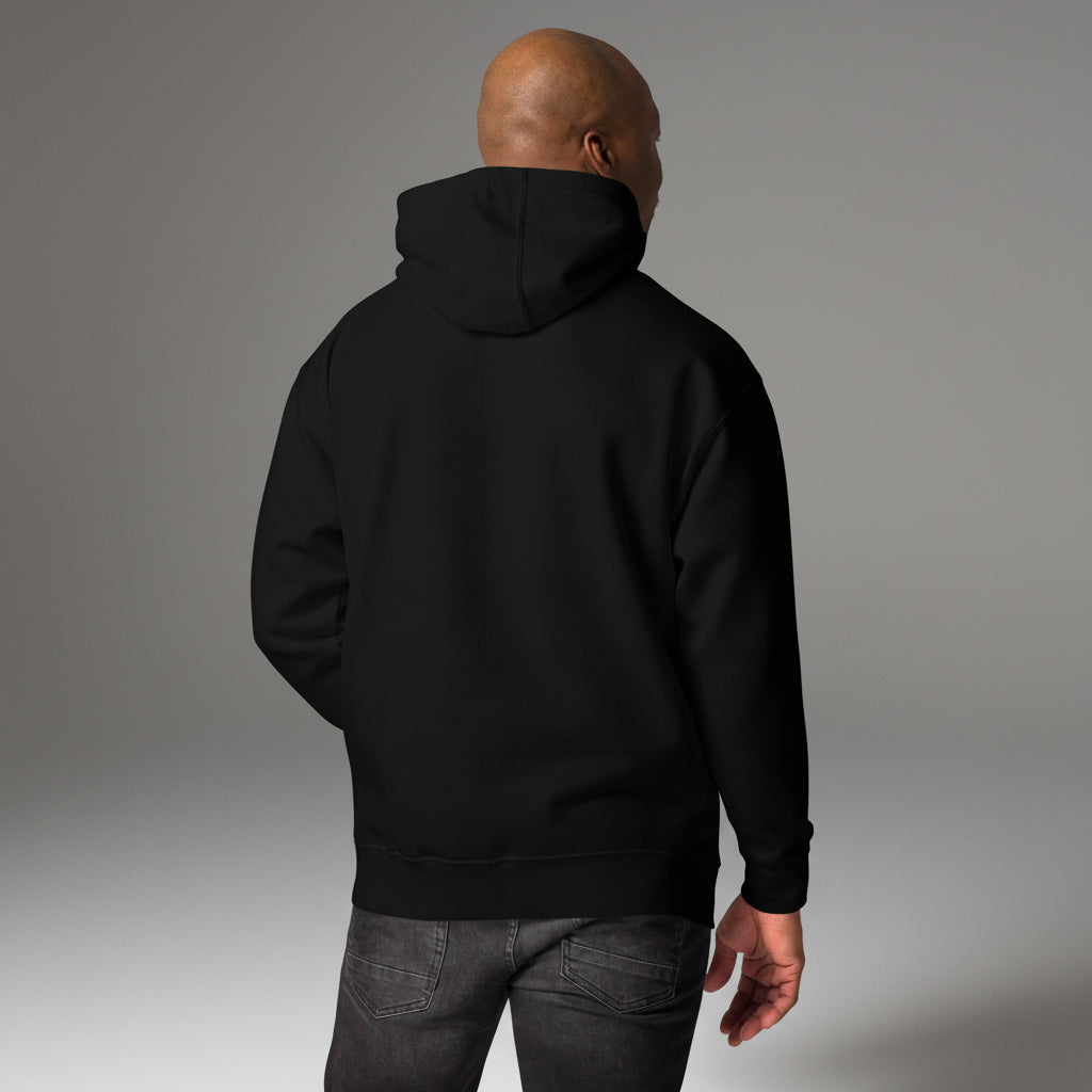 Person wearing a black hoodie from behind on a grey background