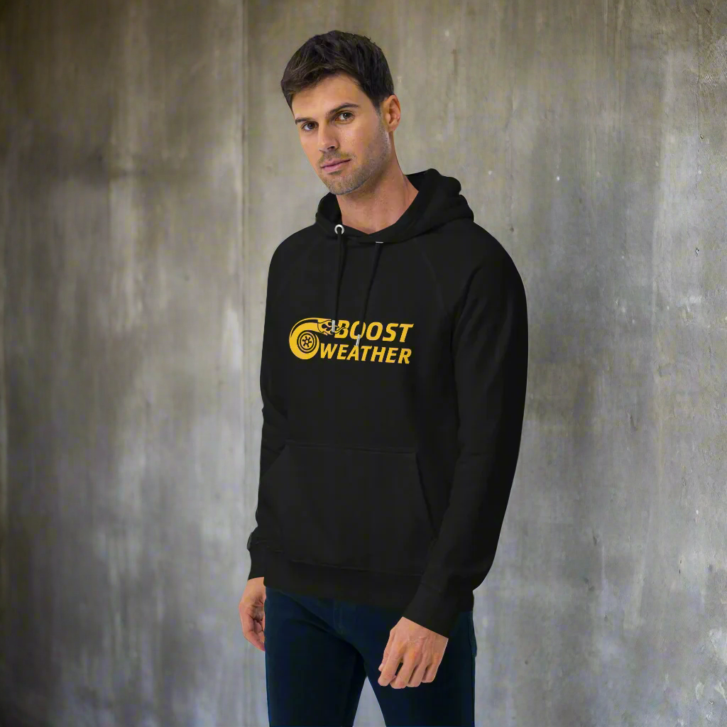 man wearing black car quote hoodie standing in front of a concrete wall