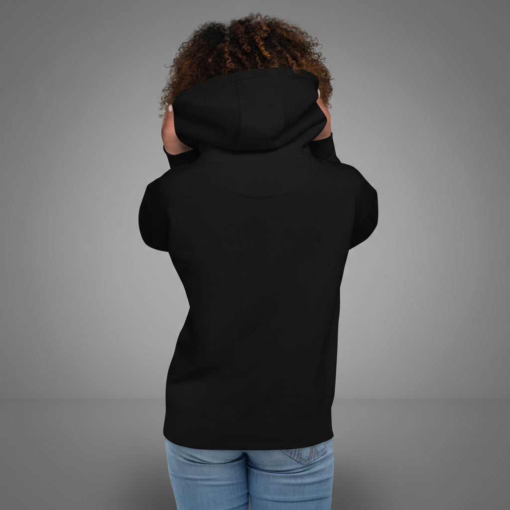 Person wearing a black hoodie on a gray background
