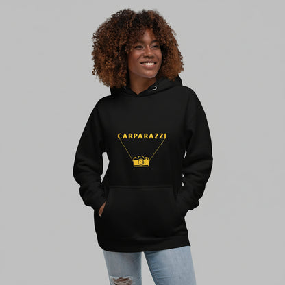 Person wearing a black hoodie with 'CARPARAZZI' logo on a white background