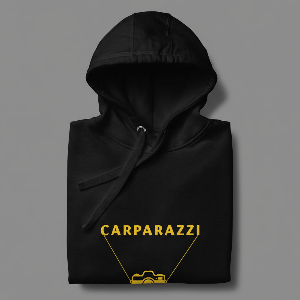 Black hoodie with yellow 'CARPARAZZI' and camera design on a gray background