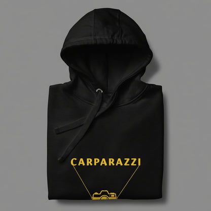 Black hoodie with yellow 'CARPARAZZI' and camera design on a gray background