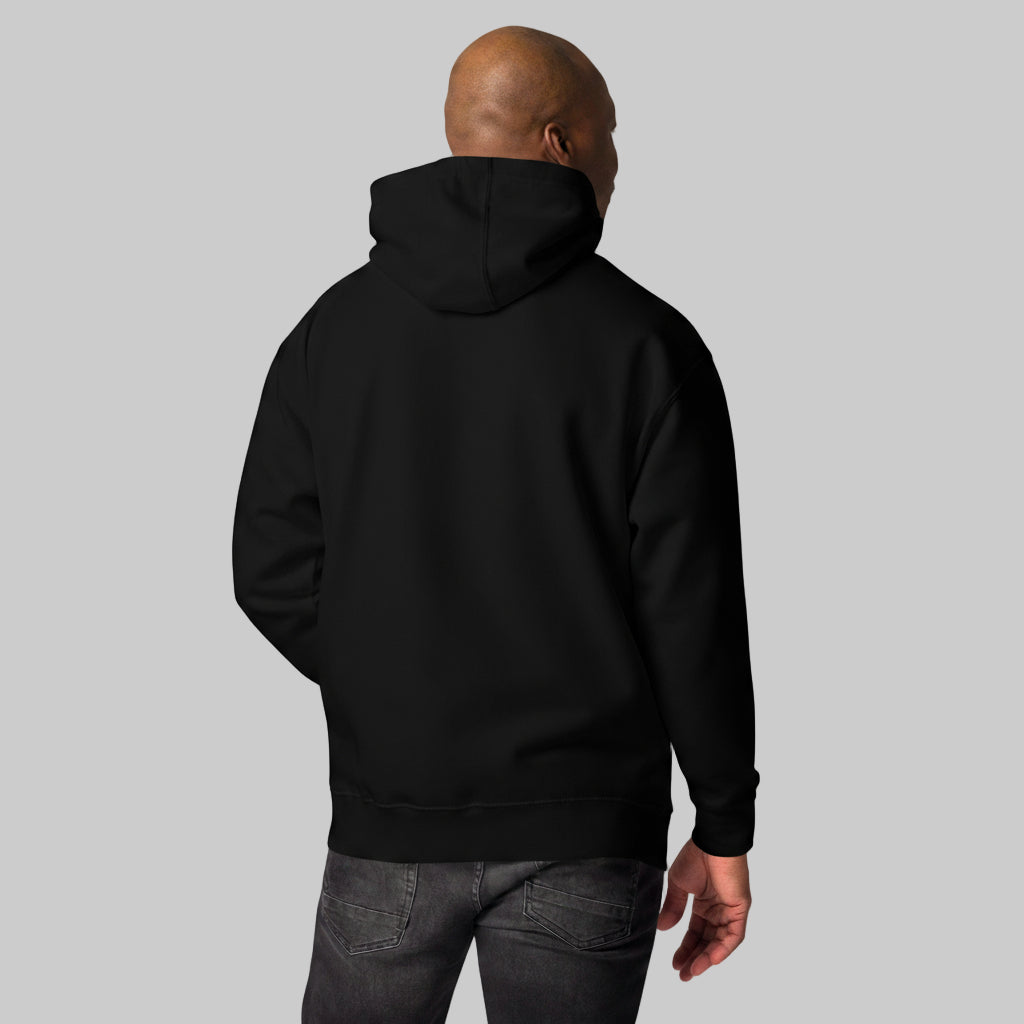 Person wearing a black hoodie from behind on a gray background