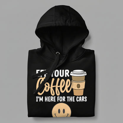 Black hoodie with coffee cup graphic and text on a gray background