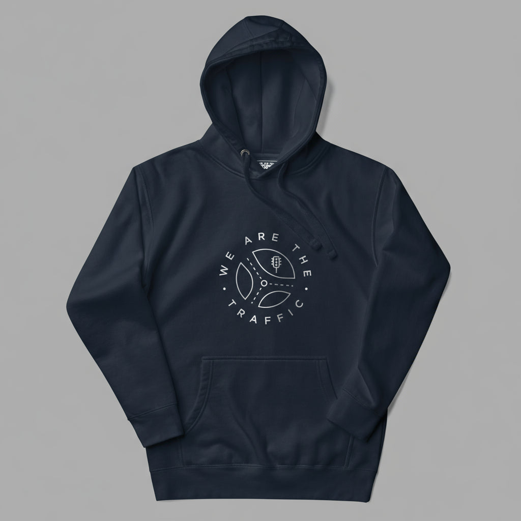 Navy blue hoodie with 'We Are The Traffic' logo on a gray background