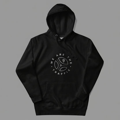 Black hoodie with 'We Are The Traffic' logo on a gray background