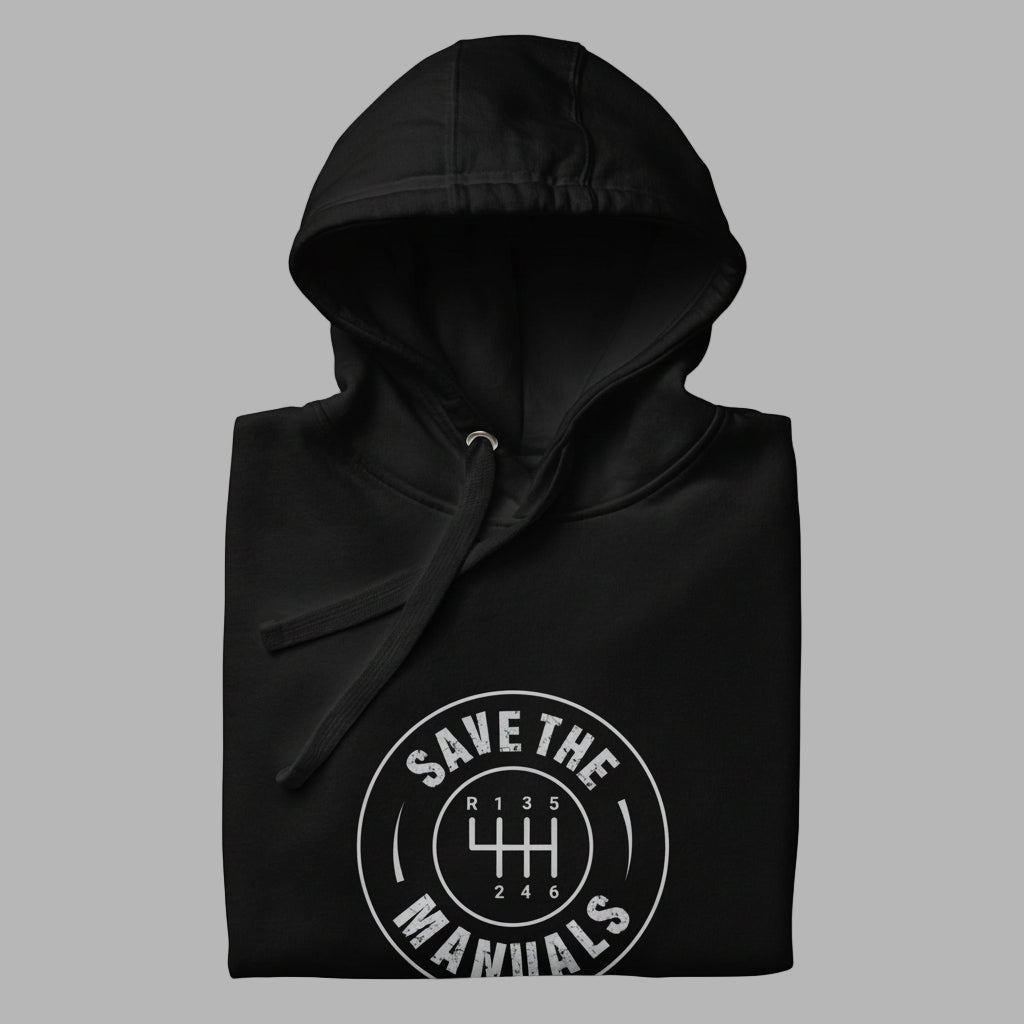 Black hoodie folded with 'Save the Manuals' logo on ag ray background