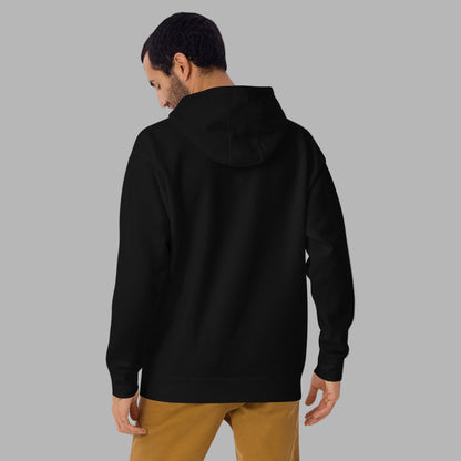 Man wearing a black hoodie from behind on a gray background