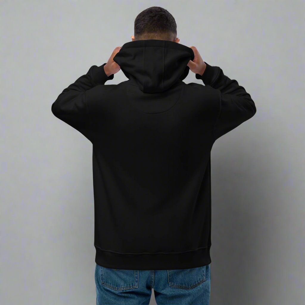 man standing backwards wearing black hoodie