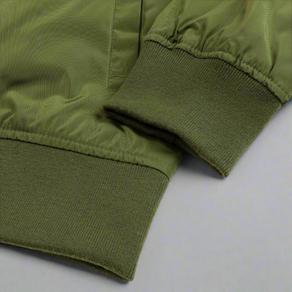 Rib detail of green bomber jacket