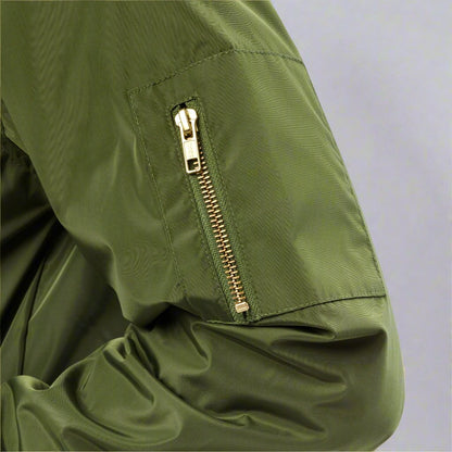 Zipper on arm of green bomber jacket