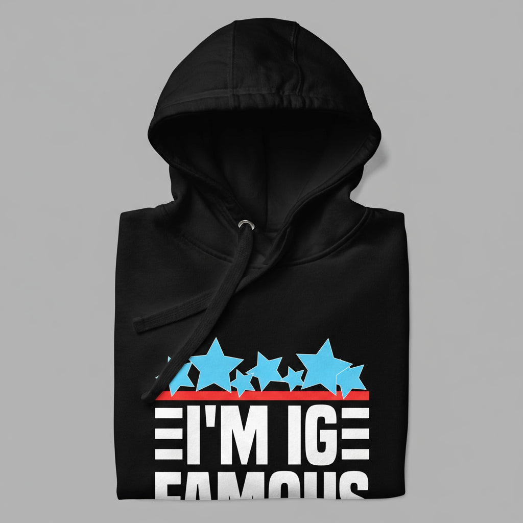 closeup of a black hoodie showing hood, flat drawstring, and design