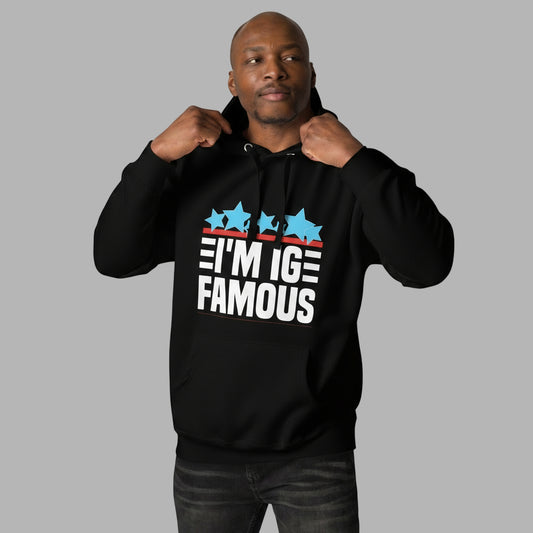 man wearing black i'm IG Famous hoodie with white lettering and blue stars.