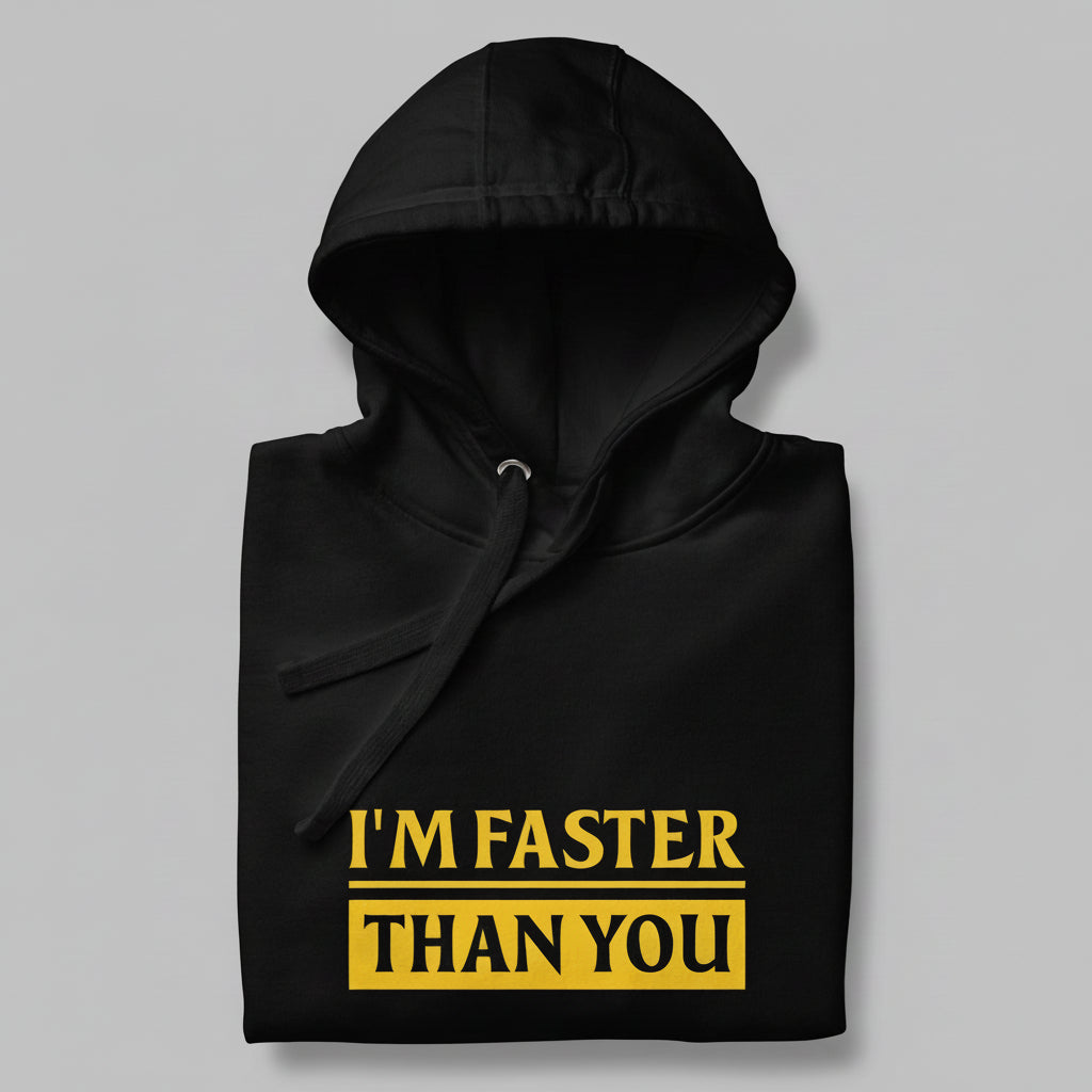 Black hoodie folded with yellow text 'I'M FASTER THAN YOU' on a gray background
