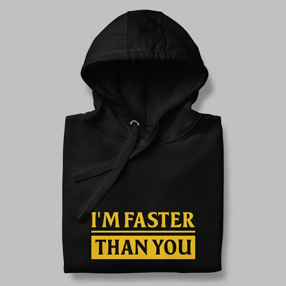 Black hoodie folded with yellow text 'I'M FASTER THAN YOU' on a gray background