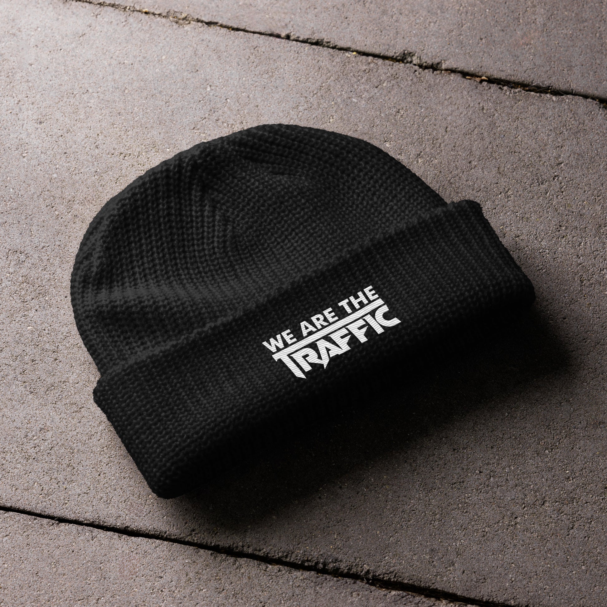 black knit hat with white logo