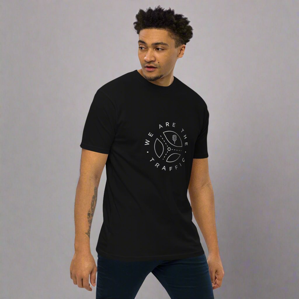 male model wearing black t-shirt with we are the traffic circular logo in gray