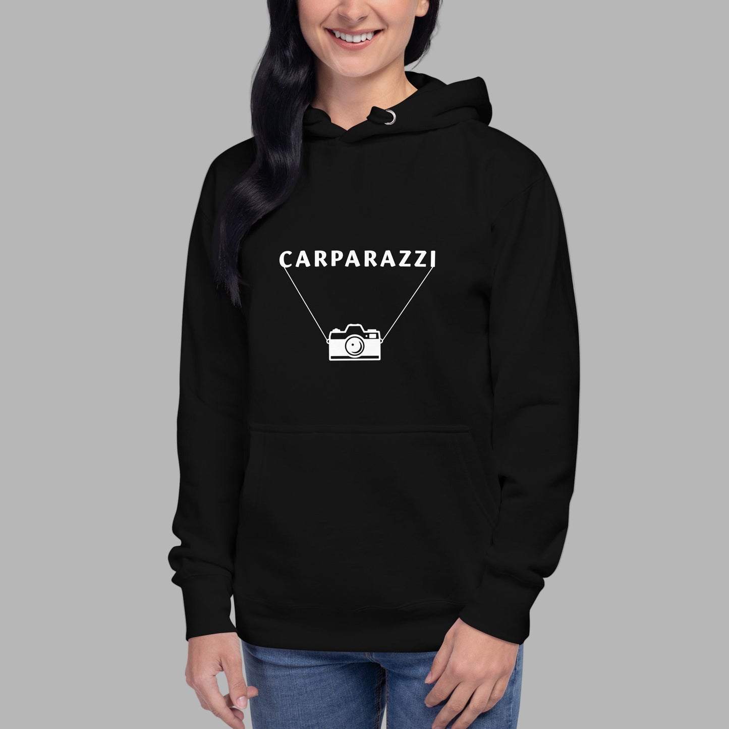 Person wearing a black hoodie with white 'CARPARAZZI' and a camera logo on a gray background