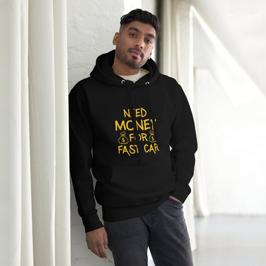 Man wearing a black hoodie with yellow text standing against a white wall.