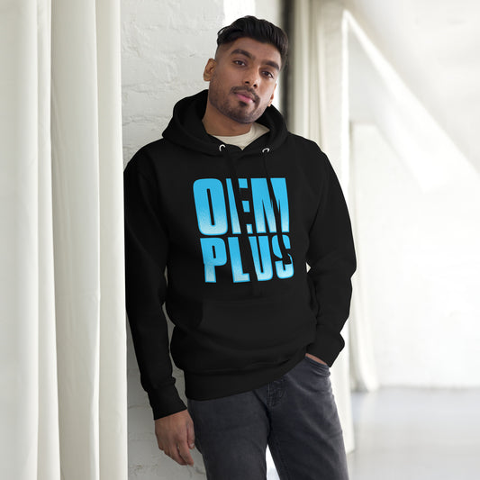 Man wearing a black hoodie with blue "OEM PLUS" text standing against a white wall.