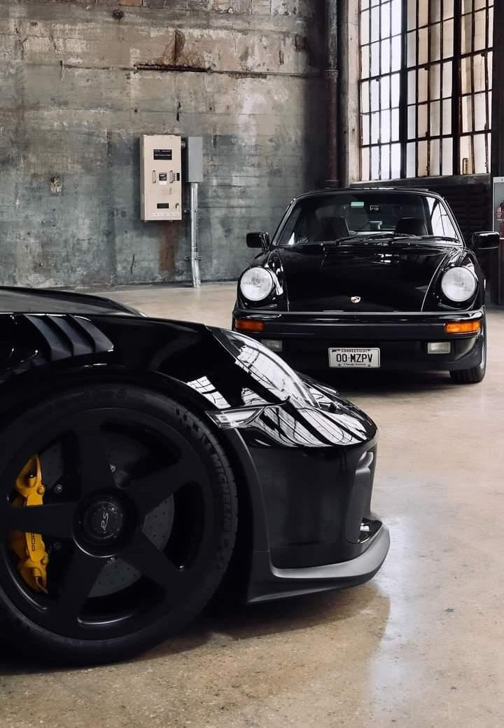 Two black porches in an industrial garage.