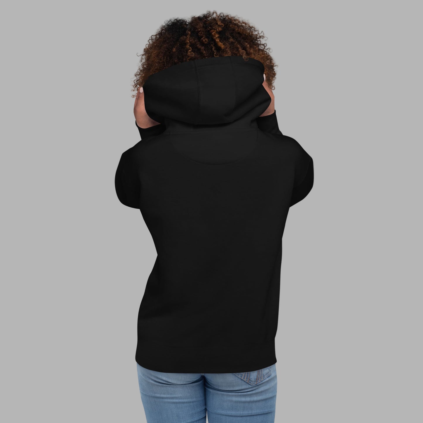 Person wearing black hoodie showing off the hood detail