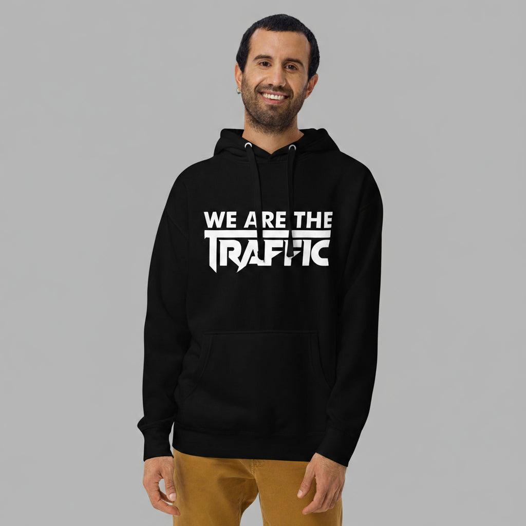 Man wearing a black hoodie with 'WE ARE THE TRAFFIC' text on a gray background