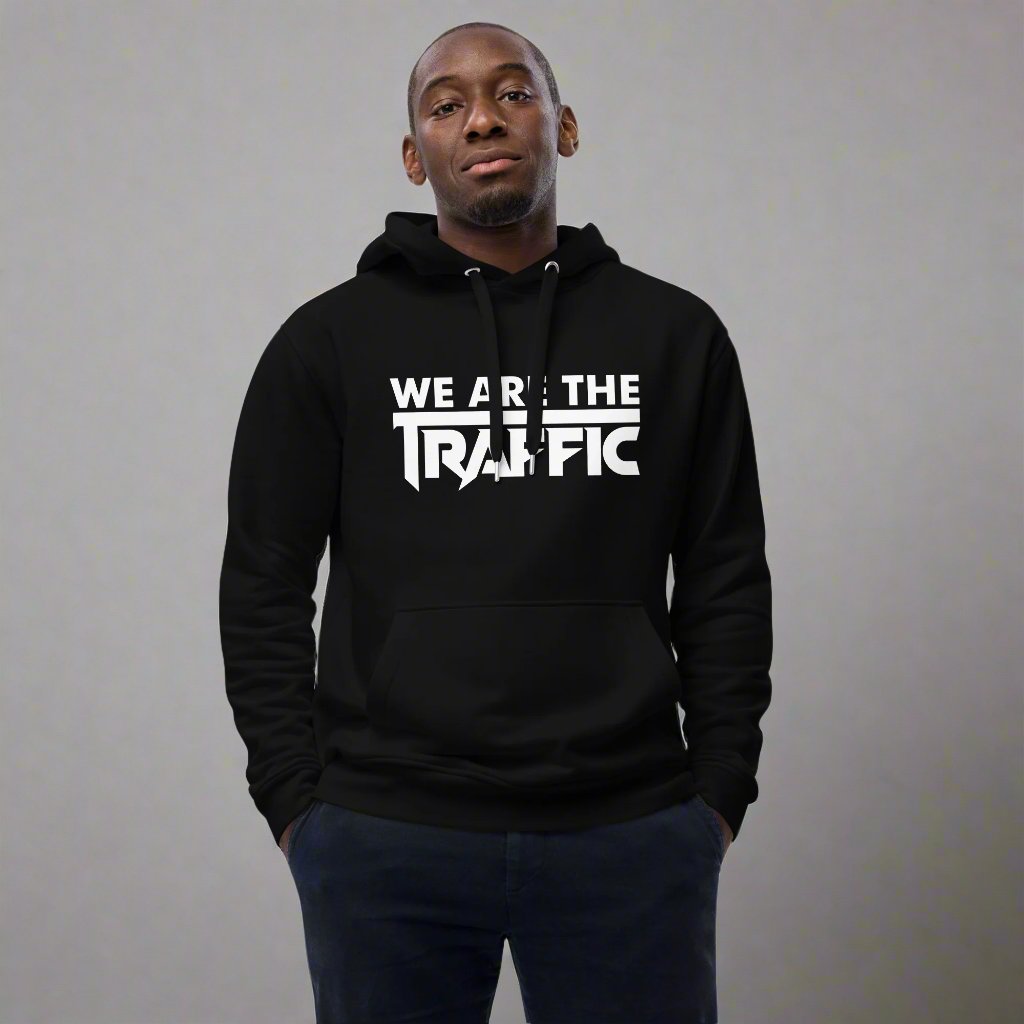 Man wearing black hoodie with white We Are The Traffic logo